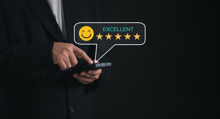  business professional confidently uses a mobile device to give a 5-star rating, expressing satisfaction and appreciation for the exceptional services recently the value of quality service business.