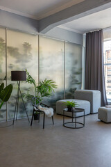 a spectacular area with a table and chair against the backdrop of a transparent designer partition behind which there are plants