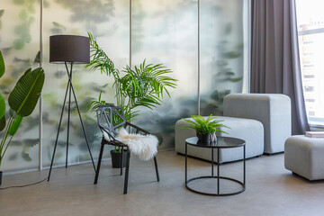 a spectacular area with a table and chair against the backdrop of a transparent designer partition...