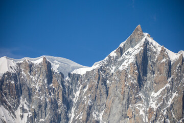 close view of the mountain peak of mont mondit near mont blanc under a sunny blue sky