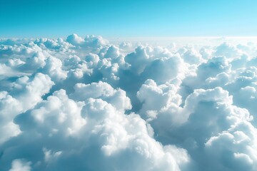 Fototapeta premium Above the clouds view with a bright blue sky. Weather and atmosphere concept. Image for wallpaper and banner with copy space. 