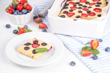 Mixed Berry Sheet Pan baked Pancakes, simple idea recipe. with fresh blueberry and strawberry, copy space