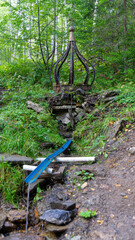 Radon source of holy and miraculous water of Platonida in forest near Mount Shunut or Shunut-Kamen in Sverdlovsk region of Russia, west of Yekaterinburg. Vertical image
