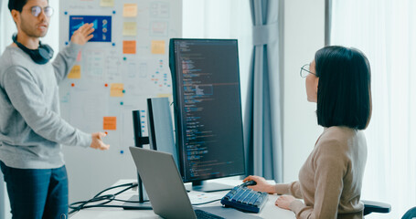 Group adult Asia male female software developers mentor leader manager talk strategy plan to...