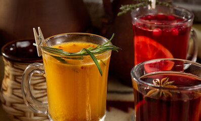 Assorted Hot Drinks Mulled Wine, Sea Buckthorn Tea, and Rosemary Tea - Cozy Warm Beverage Composition