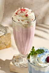 Delicious Strawberry Milkshake in Fancy Glass with Whipped Cream and Sprinkles - Perfect for Refreshing Summer Treats