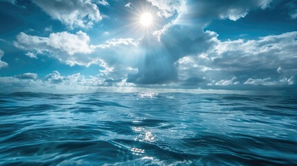 Fototapeta premium Sunny and cloudy sky over blue sea, underwater view, summer seascape.