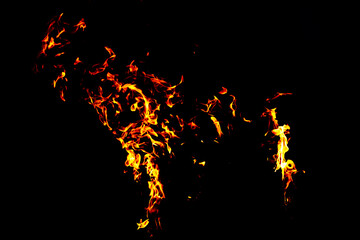 Fire flame texture. Burning material backdrop. Burn effect pattern. Blaze and torch wallpaper. Heat and haze backdrop.
