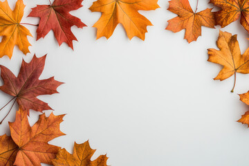 A serene composition of vibrant autumn maple leaves on a clean white background, perfect for seasonal designs, invitations, or marketing materials.