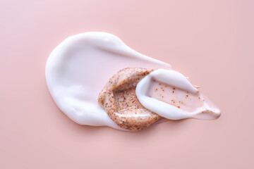 Cream and cream scrub on a pink background. Texture.
