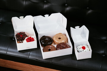 a treat of sweet delicious doughnut in sunny day at the cake shop