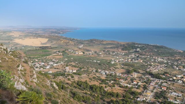 Camera pan over the south coast of Sicily to the city of Sciacca, Italy