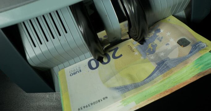 Euro banknotes of different denominations during counting in the counting machine. The currency of the European Union. Close-up