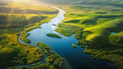 Aerial view of a winding river through lush green valleys with vibrant landscapes, showing the beauty of nature's untouched wilderness and scenic serenity