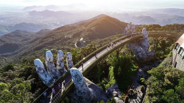 Tourist walking at Golden bridge in Bana hills, Da nang, Vietnam.