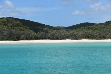 Sailing on the crystal clear turqoise blue water around the white sand beaches of Fraser Island in Queensland, Australia