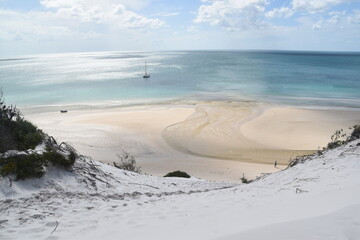 Sailing on the crystal clear turqoise blue water around the white sand beaches of Fraser Island in Queensland, Australia