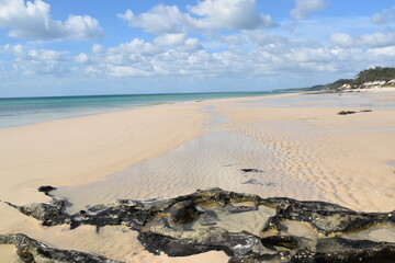 Sailing on the crystal clear turqoise blue water around the white sand beaches of Fraser Island in Queensland, Australia