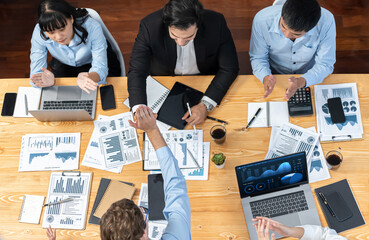 Two businessman shake hand in meeting room with coworker give cheerful applause. Team of analyst...