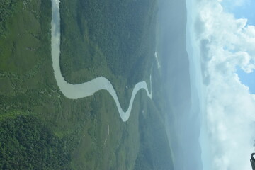 The lush green landscapes of Queensland and Whitsunday islands seen from above in a small airplane