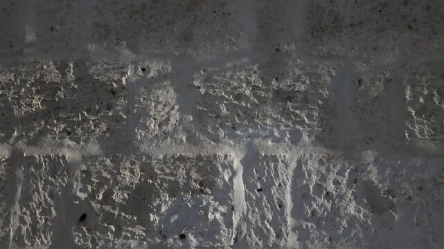 a close up panning shot showing the sillar stone used in Arequipa Peru's historic architecture