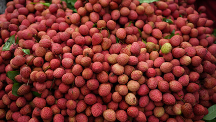 Freshly picked ripe lychees, ready for sale at the market. Vibrant colors and juicy sweetness of this tropical delight, straight from the orchard to your table. Lychee, Litchi, Lichee, fruit