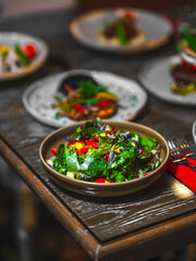 A vibrant and nutritious plate featuring an assortment of fresh vegetables, lean proteins