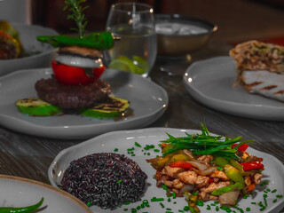 A vibrant and nutritious plate featuring an assortment of fresh vegetables, lean proteins