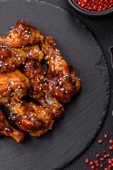 Delicious crispy baked chicken wings in teriyaki sauce