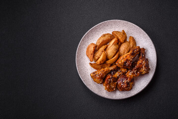 Delicious crispy baked chicken wings in teriyaki sauce