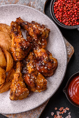 Delicious crispy baked chicken wings in teriyaki sauce
