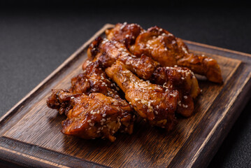 Delicious crispy baked chicken wings in teriyaki sauce