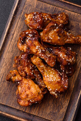 Delicious crispy baked chicken wings in teriyaki sauce