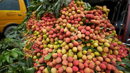 Freshly picked ripe lychees, ready for sale at the market. Vibrant colors and juicy sweetness of this tropical delight, straight from the orchard to your table. Lychee, Litchi, Lichee, fruit