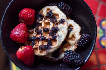 gluten free waffles with fruit in the same bowl