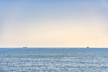 Obraz premium Scenic landscape with Nachi Katsuura Katsuoshima Lighthouse on the Pacific Ocean coast in Nachikatsuura, Wakayama, Japan.