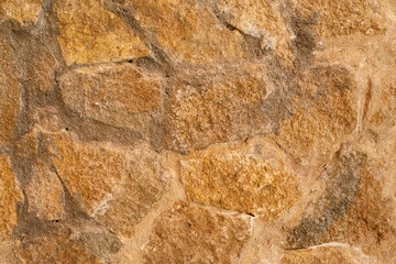 The rough texture of a stone wall a testament to time and nature s artistry