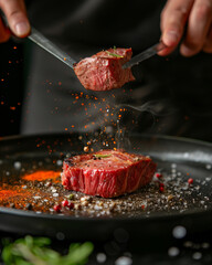 Chef hands cooking meat steak