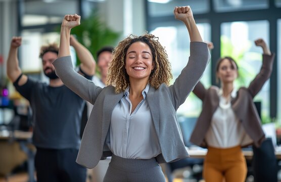 Office workers from different backgrounds engaged in group stretching exercises during a break