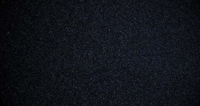 Black sand grunge background. Сlose-up.