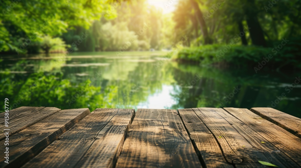 Canvas Prints Wooden table against blurred green scenery with water. Fresh and relaxing theme for product displays or designs. Ample space for text.