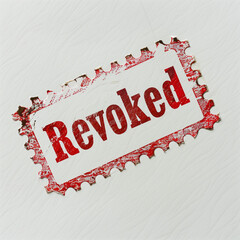 A bold red stamp imprint with the word "Revoked" in distressed, all-caps lettering, stamped on crisp white paper. The stamp is slightly uneven, giving it an authentic and urgent appearance 