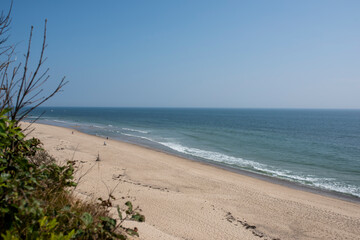 several people enjoy an ocean side beach in cape cod Massachusetts