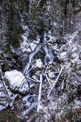 Ulenski skok waterfall on Demyanishka river after snowfall. Winter landscape in Pirin mountains near Bansko, Bulgaria. © Anna