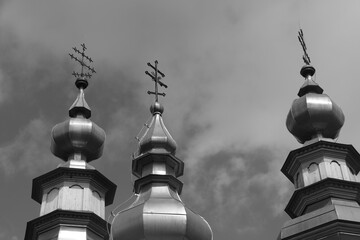 close-up of three towers with Orthodox crosses of the Orthodox church of St. Michael the Archangel...