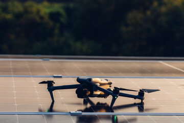 Drone inspects damage on solar panel in a Rooftop Renewable energy. Engineer surveyor team Use...