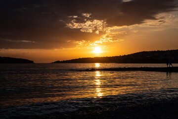 Amazing sunset sky over small town of Rogoznica, Croatia, during summer season