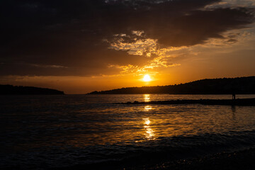 Naklejka premium Amazing sunset sky over small town of Rogoznica, Croatia, during summer season