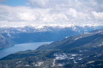 aerial view over trail in Patagonia mountains in San Martín de los Andes in summer with snow