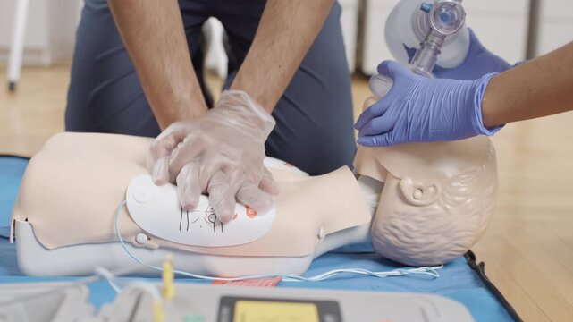 First aid training at the clinic, focusing on CPR and defibrillation techniques
